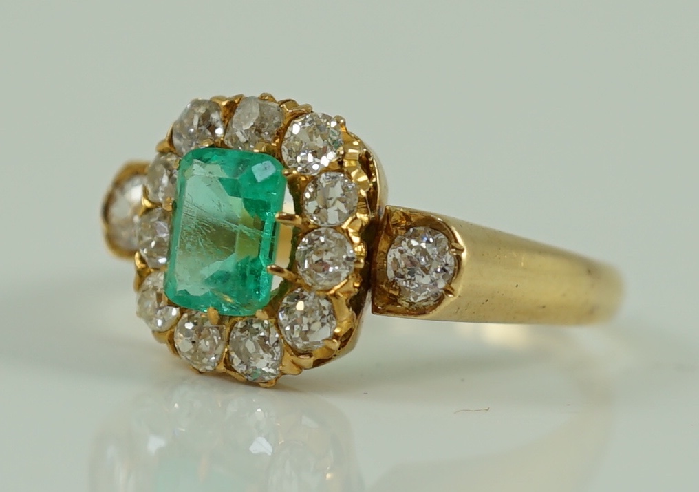 An 18ct gold, emerald and diamond octagonal cluster ring